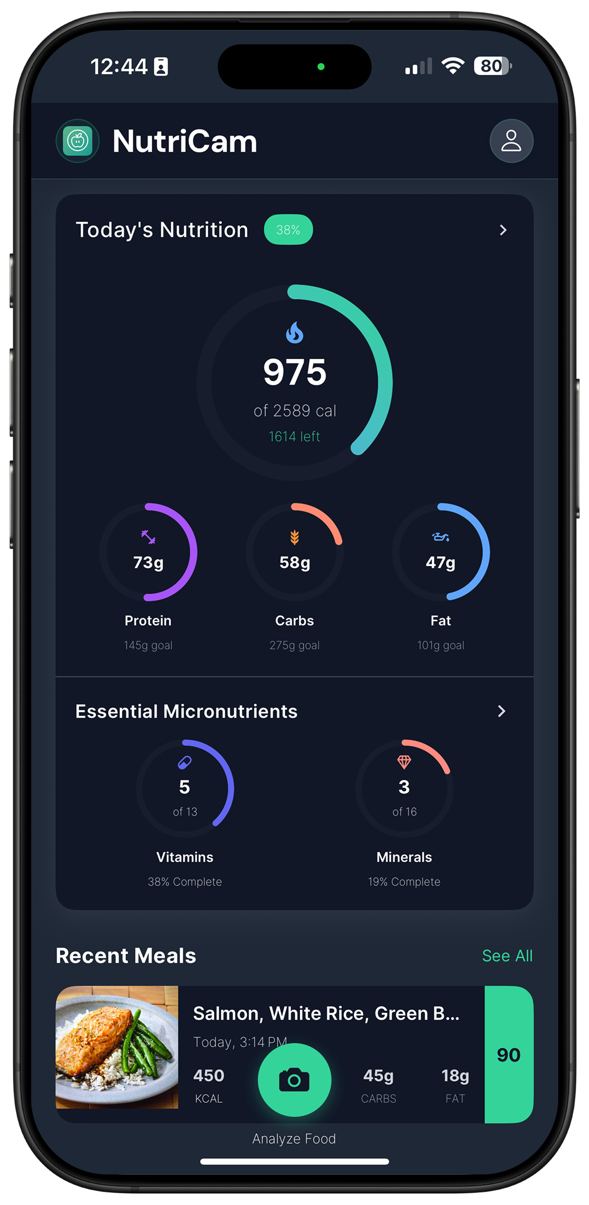 Home screen: 975 of 2,589 calories today, protein, carbs and fat against goals, vitamins and minerals progress, and the logged salmon meal